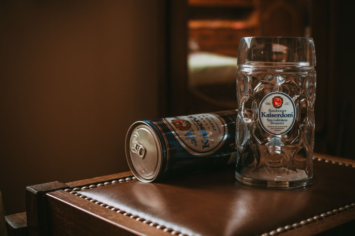 German beer stein and laptop on coffee table
